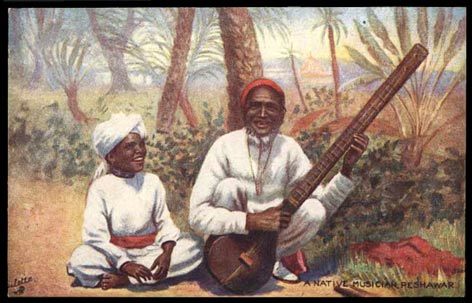 old sitar player with boy